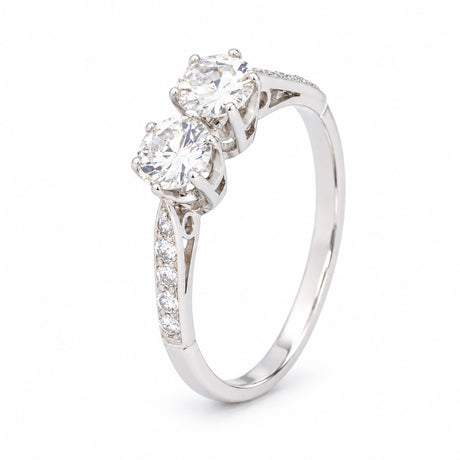 Three-quarter studio portrait of the Art Deco toi et moi ring, revealing the raised twin-diamond setting and slender platinum band.