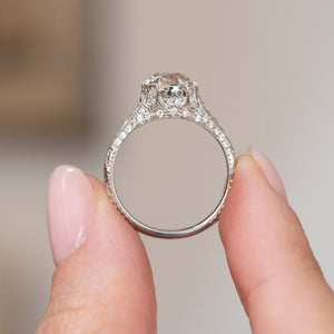 Underside view of the antique ring, showing the openwork gallery, engraved band and raised diamond setting.