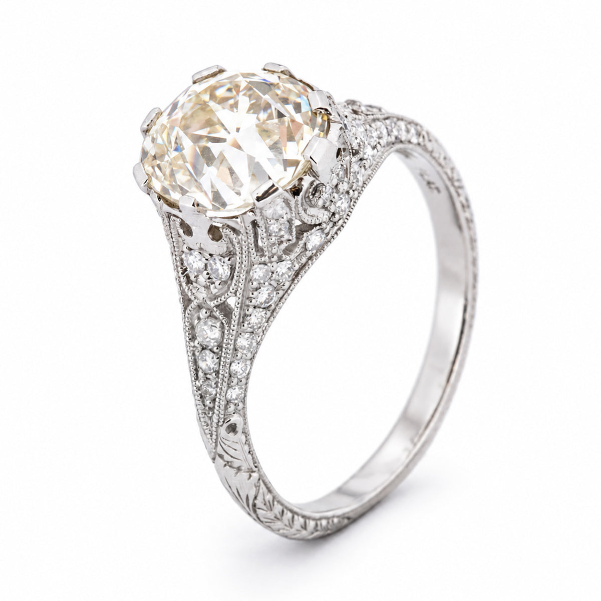 Three-quarter studio portrait of the Edwardian solitaire, showcasing its substantial old-mine diamond and intricate pierced setting.
