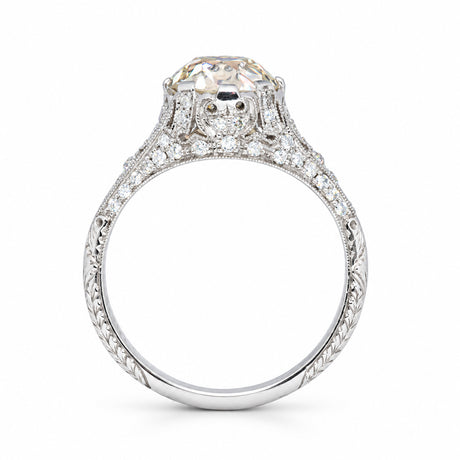Reverse profile of the antique engagement ring, revealing the ornate gallery and finely engraved diamond-set band.