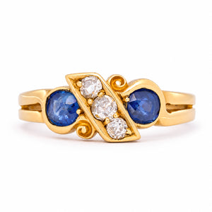 Antique Victorian five-stone engagement ring combining two cushion-cut blue sapphires with three cushion old-mine cut diamonds yellow gold.