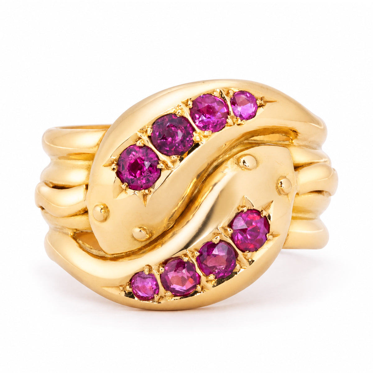 Antique Victorian ruby snake ring in carved yellow gold, featuring two intertwined snakes each set with four natural rubies.