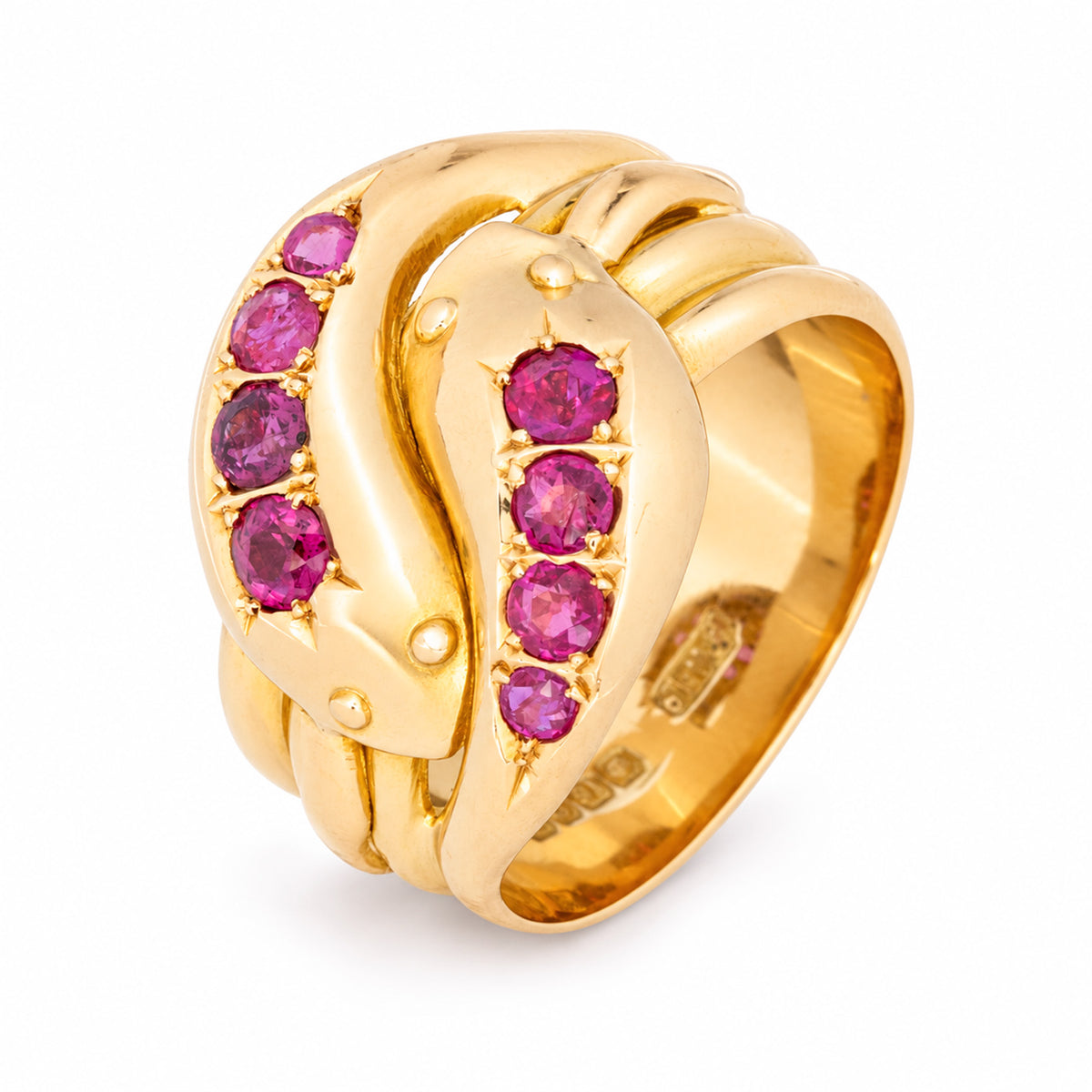 Sculptural view of the antique Victorian gold snake ring, revealing its entwined design and eight vibrant natural rubies.