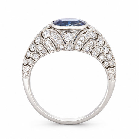 Side profile of a Belle Époque sapphire and rose-cut diamond ring, showcasing its domed silhouette and ornate platinum openwork.