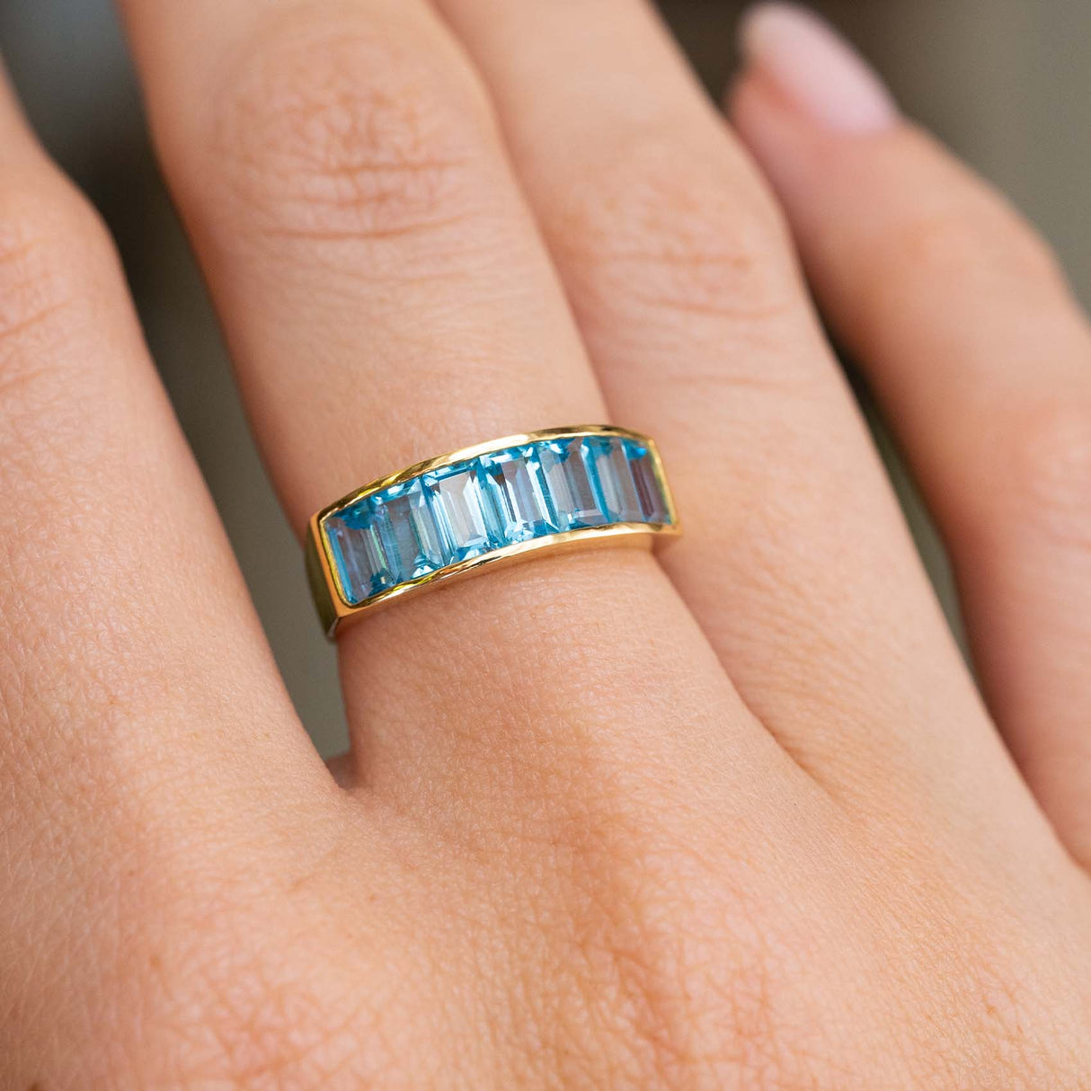 Vintage, 1980s Swiss blue topaz half eternity ring