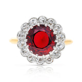 Edwardian garnet and diamond cluster ring, front view. 