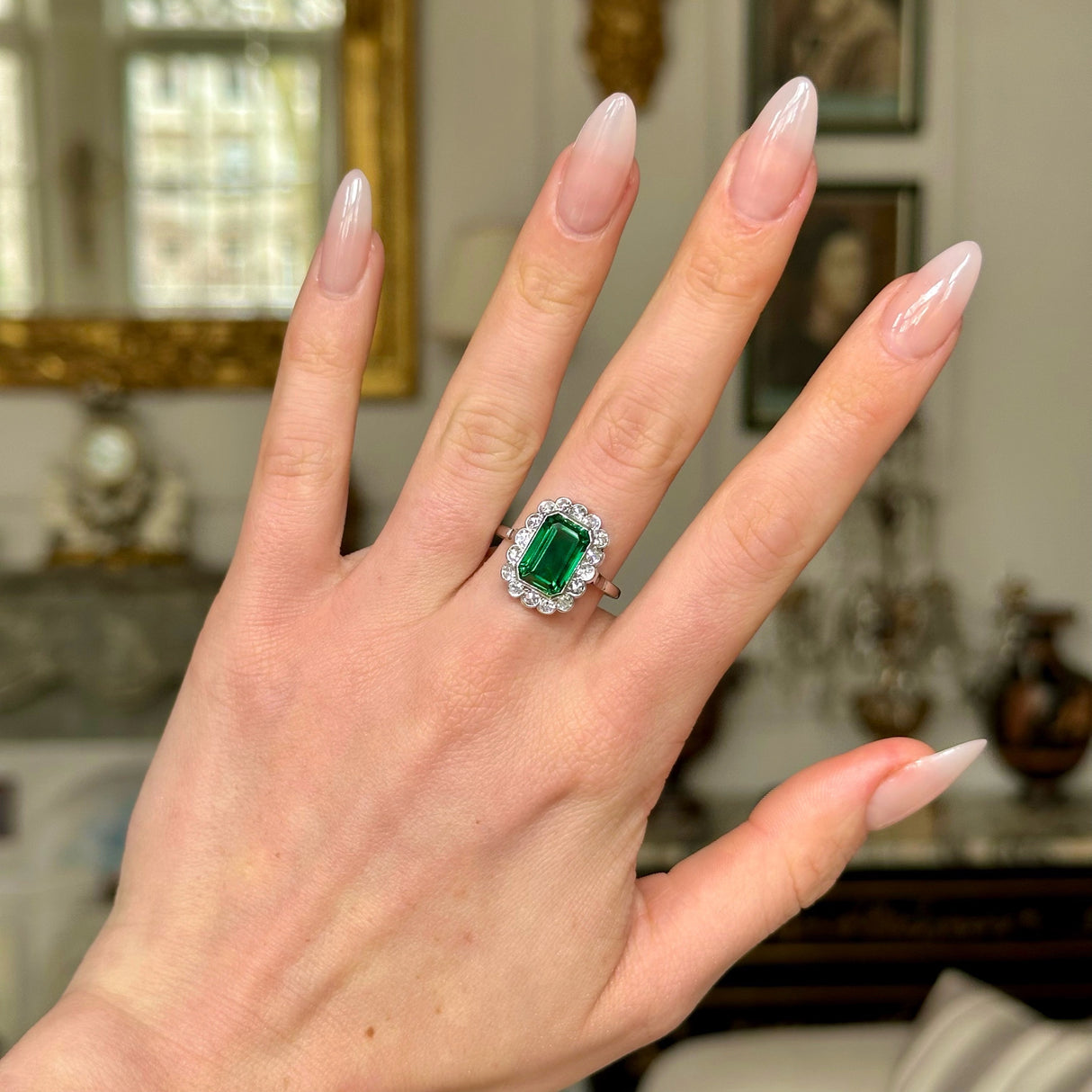 Antique green paste and diamond cluster ring, worn on hand. 