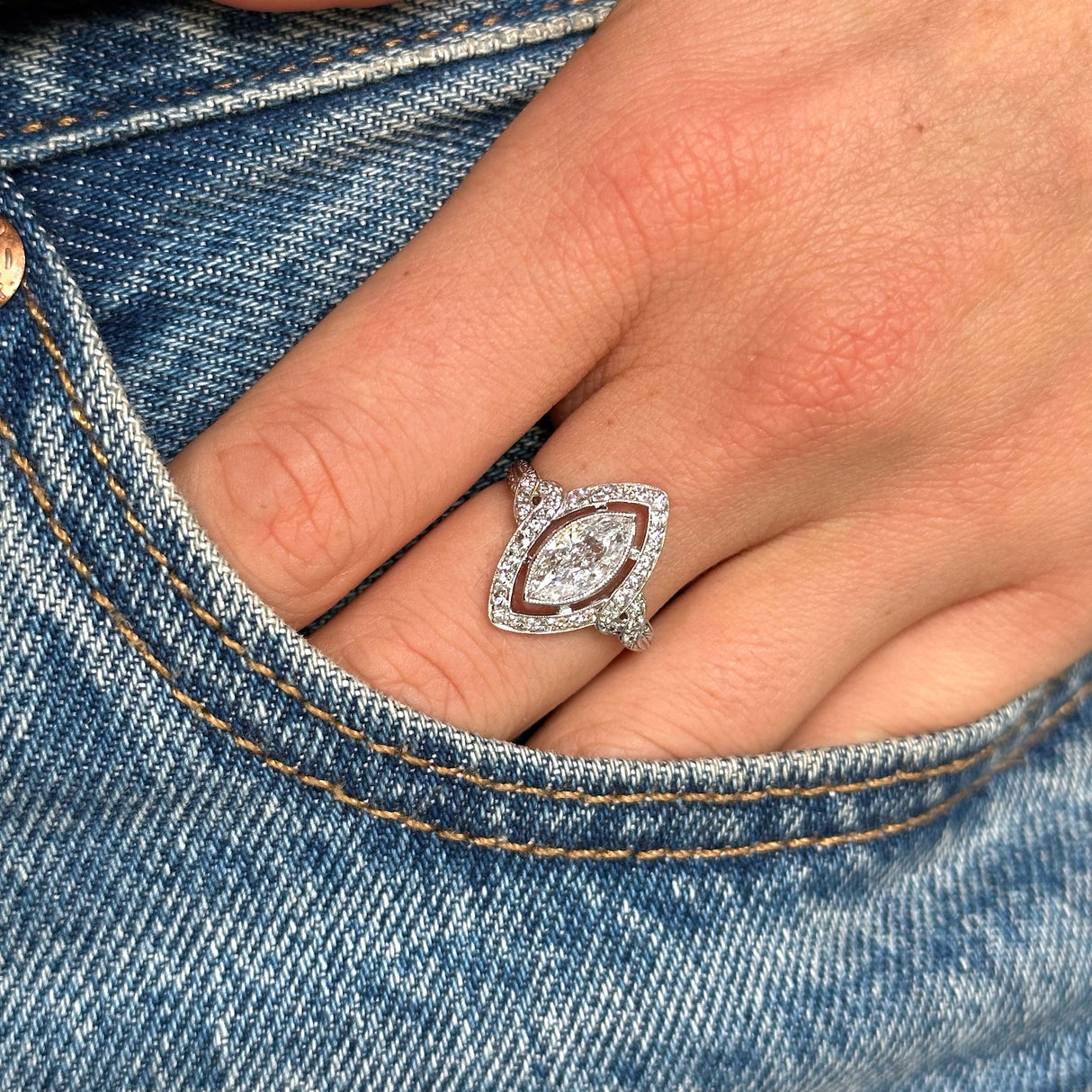 Vintage tiffany & co diamond ring, worn on hand in pocket of jeans. 