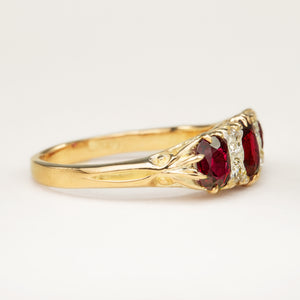 
Antique, Victorian ruby and diamond three-stone ring side view. 