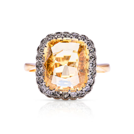 Yellow sapphire and diamond cluster ring, front view. 