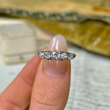 Antique, Edwardian Diamond Half Hoop Engagement Ring, 18ct Yellow Gold held in fingers.