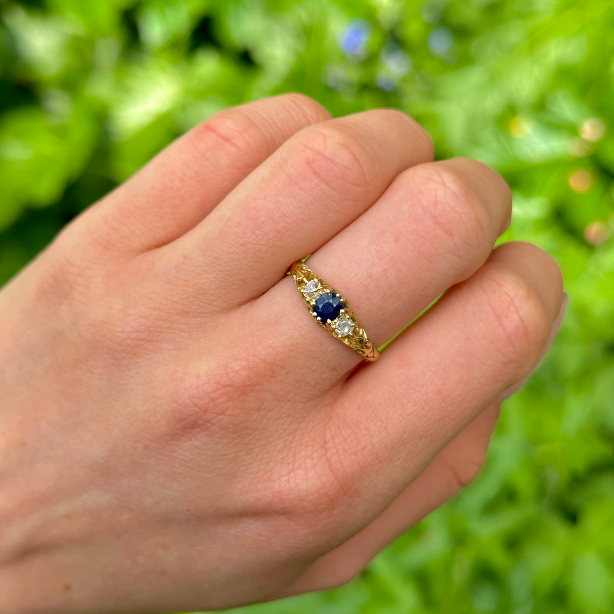 Antique, Edwardian Sapphire and Diamond Three-Stone Ring, 18ct Yellow Gold worn on hand.