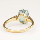 Reverse of an antique Edwardian cushion-cut aquamarine and diamond engagement ring, clearly showing the band design and hallmarks.