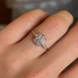 Antique, Edwardian diamond panel cluster engagement ring worn on hand close up