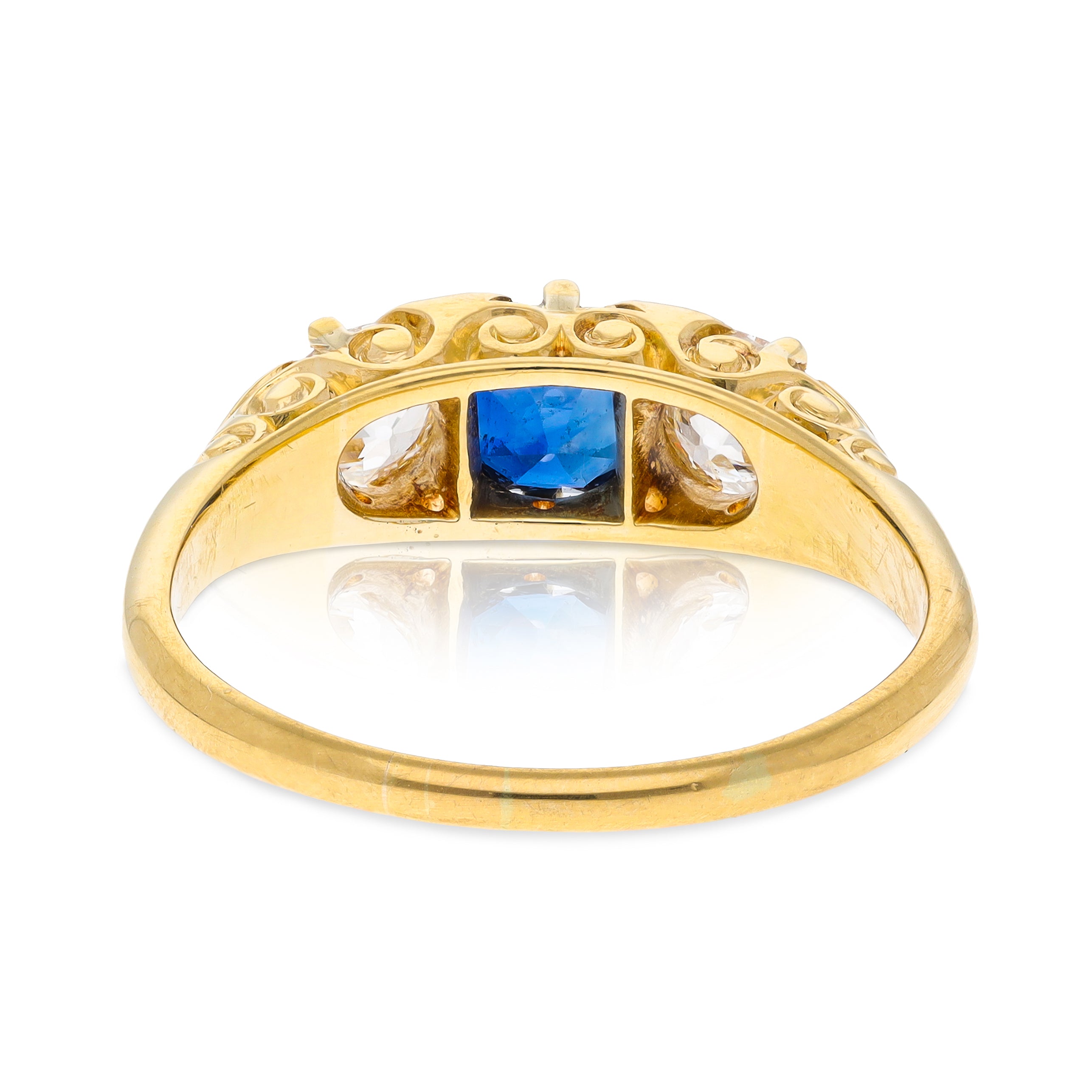 Antique, Edwardian, sapphire and diamond, carved three stone engagement ring, 18ct yellow gold