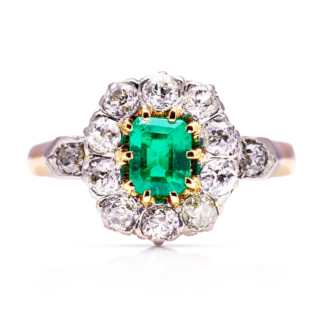 Antique emerald and diamond cluster ring, front view.