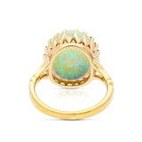 cabochon white opal cocktail ring with 18ct yellow gold band, back view. 