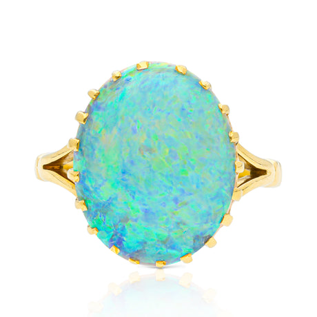 cabochon white opal cocktail ring with 18ct yellow gold band, front view. 