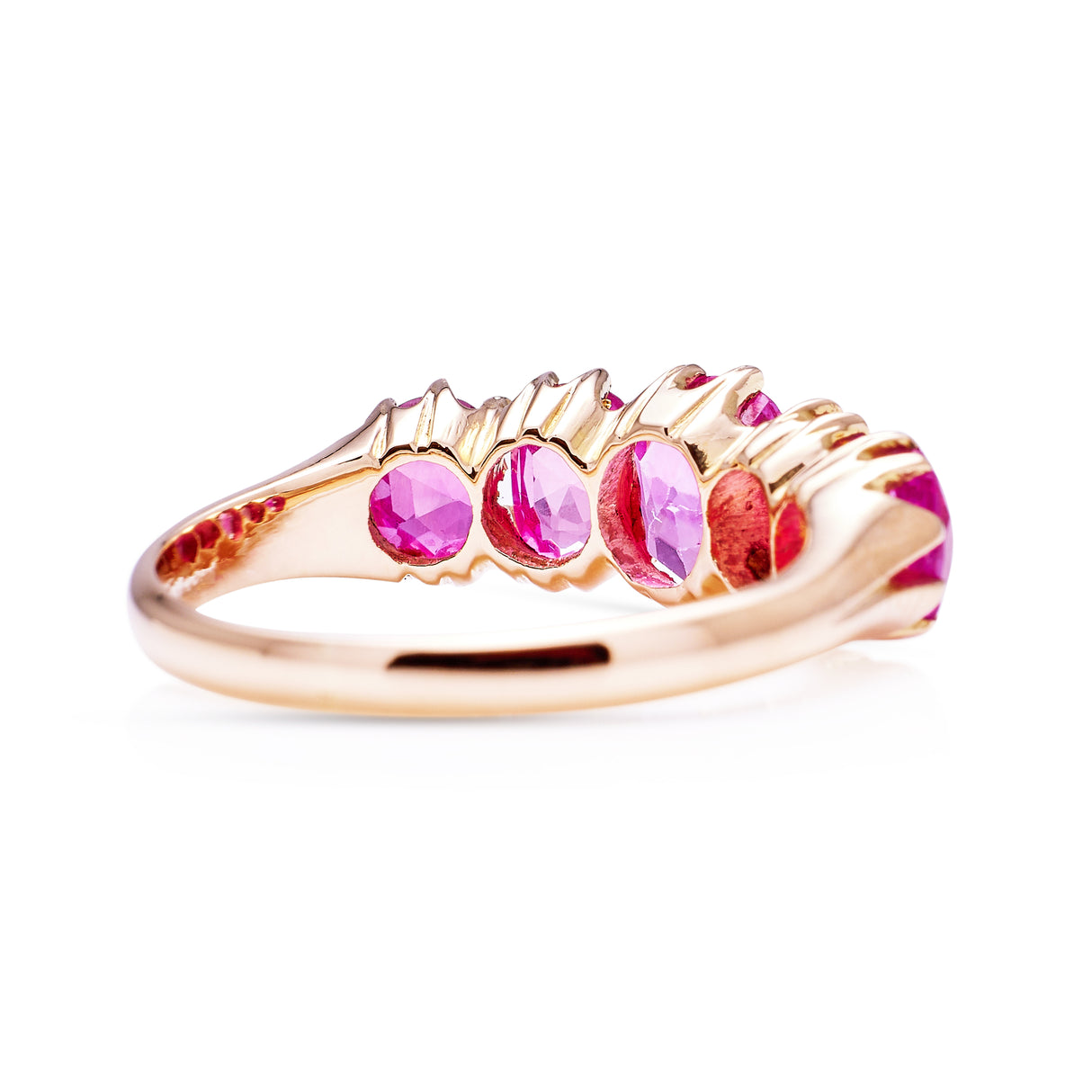 Five stone pink sapphire and yellow gold ring, back view