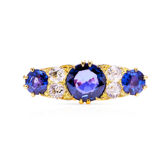 Antique purple sapphire and diamond engagement ring, front view.