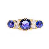 Antique purple sapphire and diamond engagement ring, front view.