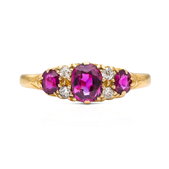 Antique Edwardian three stone ruby and diamond ring, front view. 