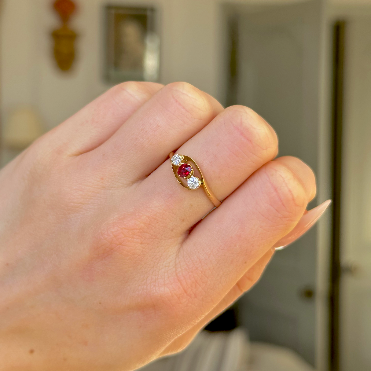 Antique, Three-Stone Ruby and Diamond Engagement Ring, 18ct Yellow Gold worn on closed hand. 