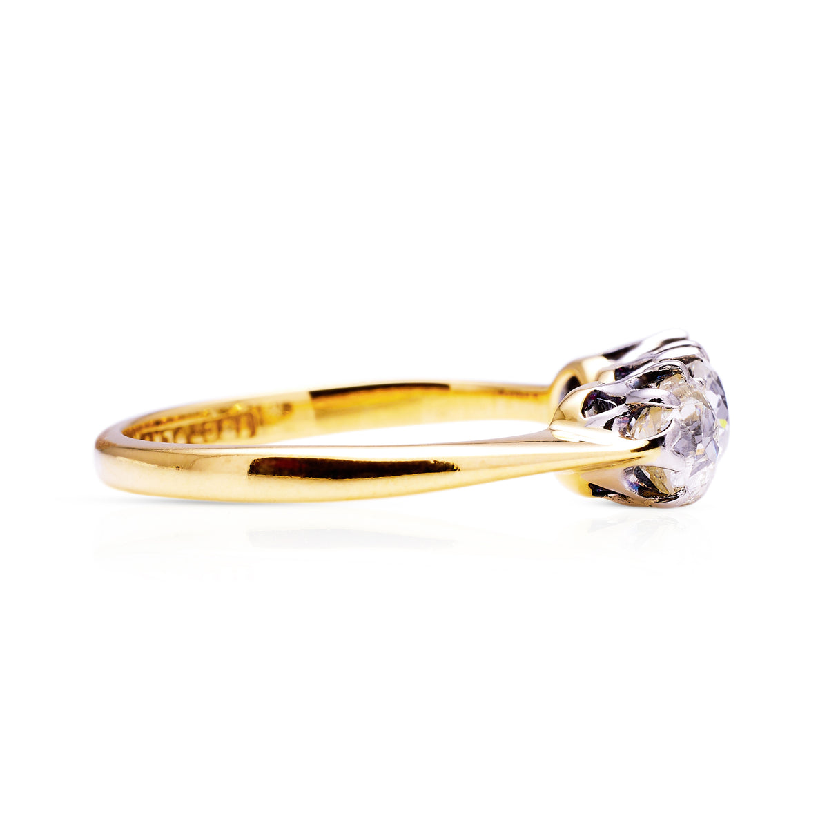 antique three stone diamond engagement ring, 18ct yellow gold band, side view. 