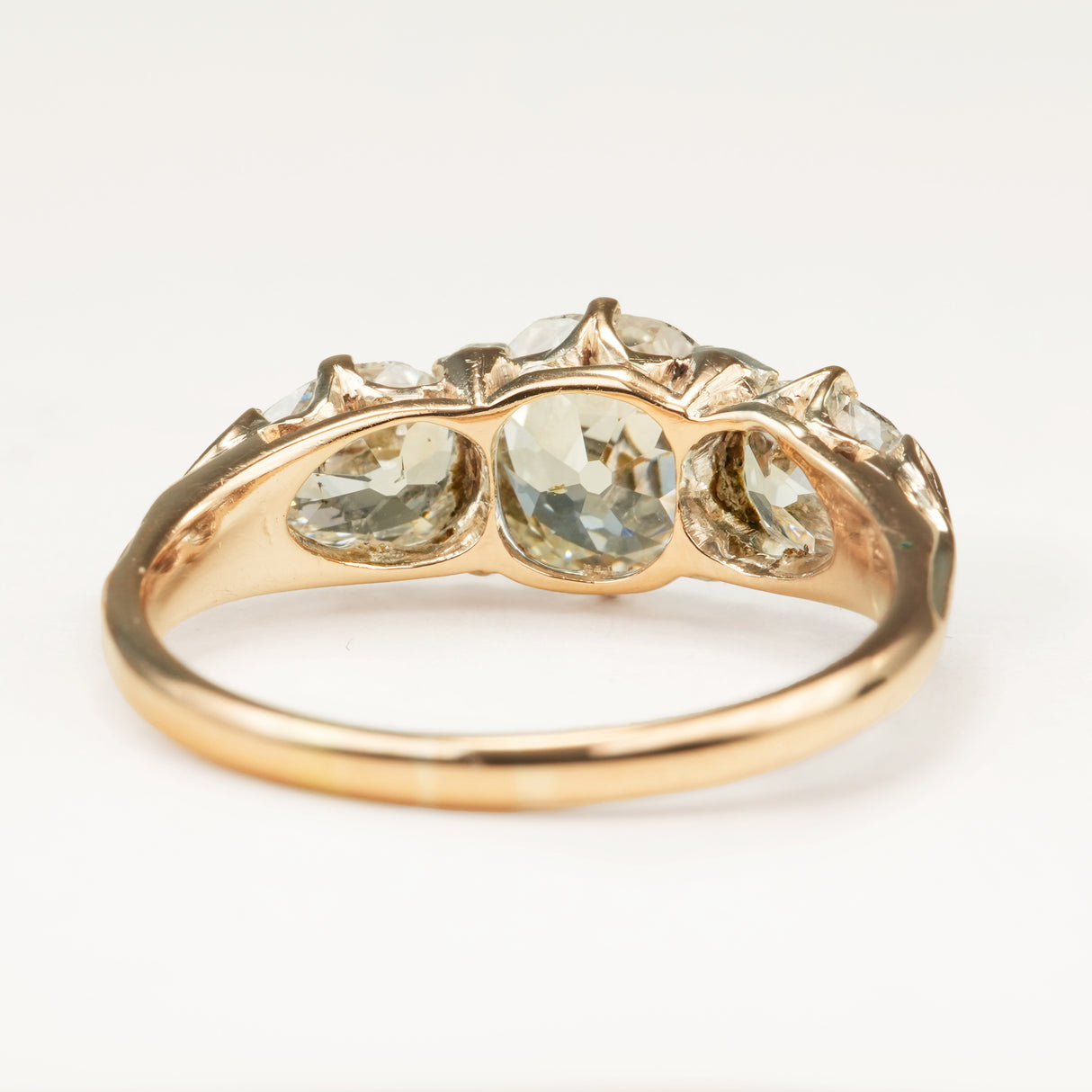 Antique Victorian three-stone with cushion-cut and pear-cut diamonds ring