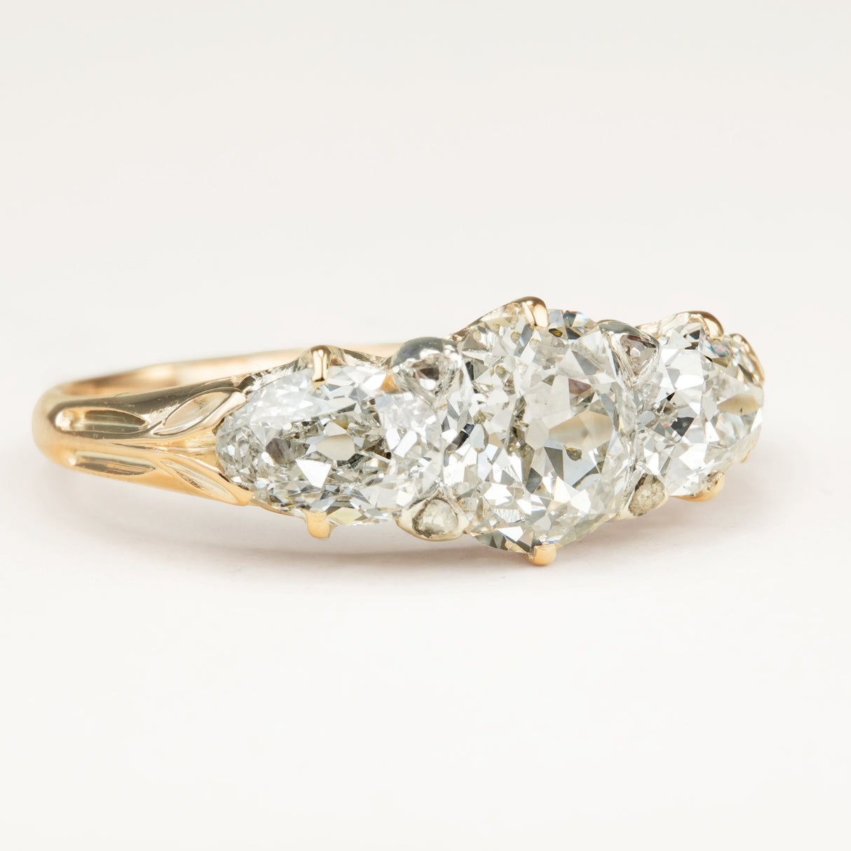 Antique Victorian three-stone with cushion-cut and pear-cut diamonds ring