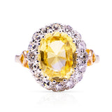Yellow sapphire and diamond cluster engagement ring, front view.