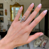 Art Nouveau diamond engagement ring,  worn on hand.