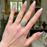 Contemporary, Black Opal and Diamond Cocktail Ring, worn on hand.