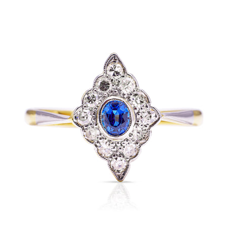 Sapphire and diamond kite shaped ring, front view.