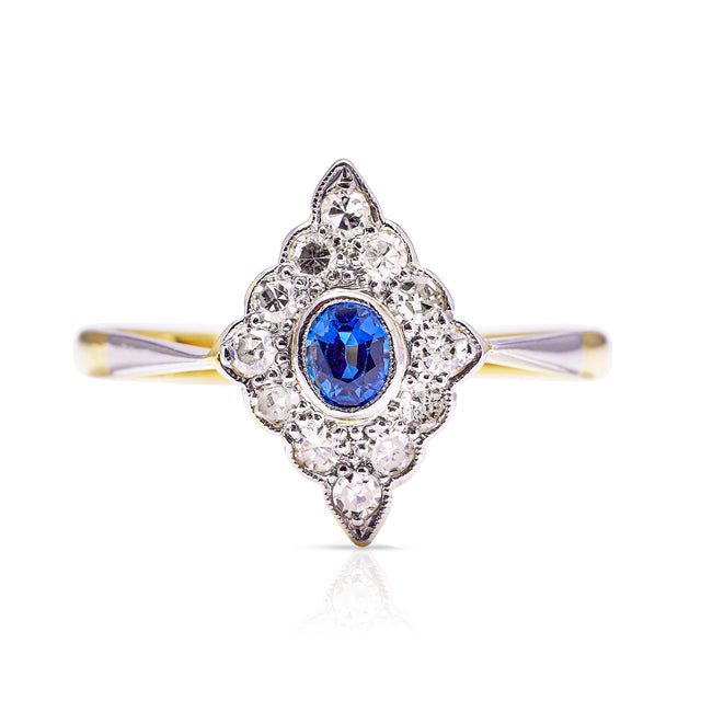 Sapphire and diamond kite shaped ring, front view.