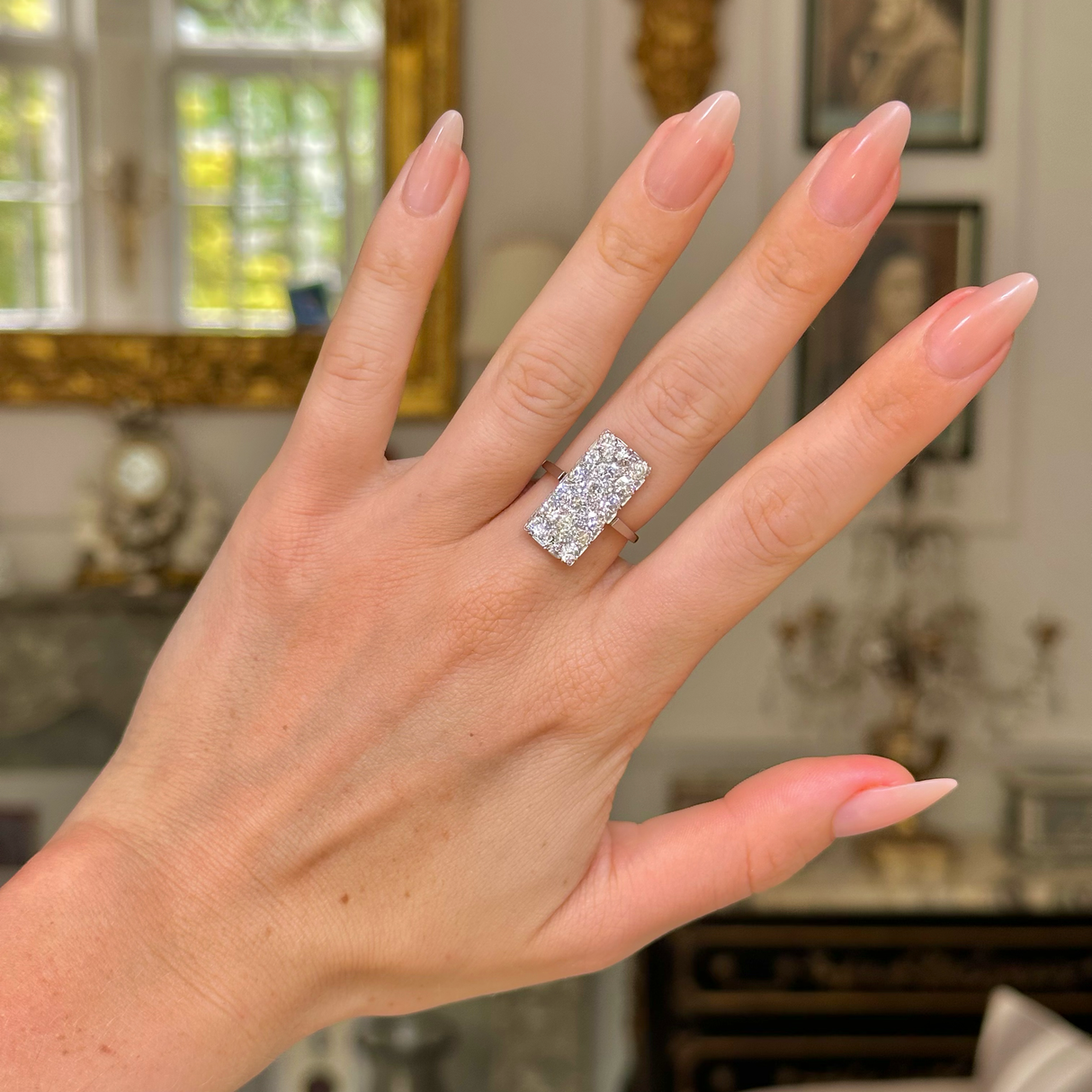 Art Deco diamond panel ring, worn on hand.