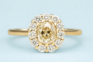 Yellow-brown tinted old mine-cut diamond cluster engagement ring