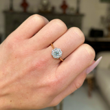 Edwardian aquamarine and diamond ring worn on closed  hand.