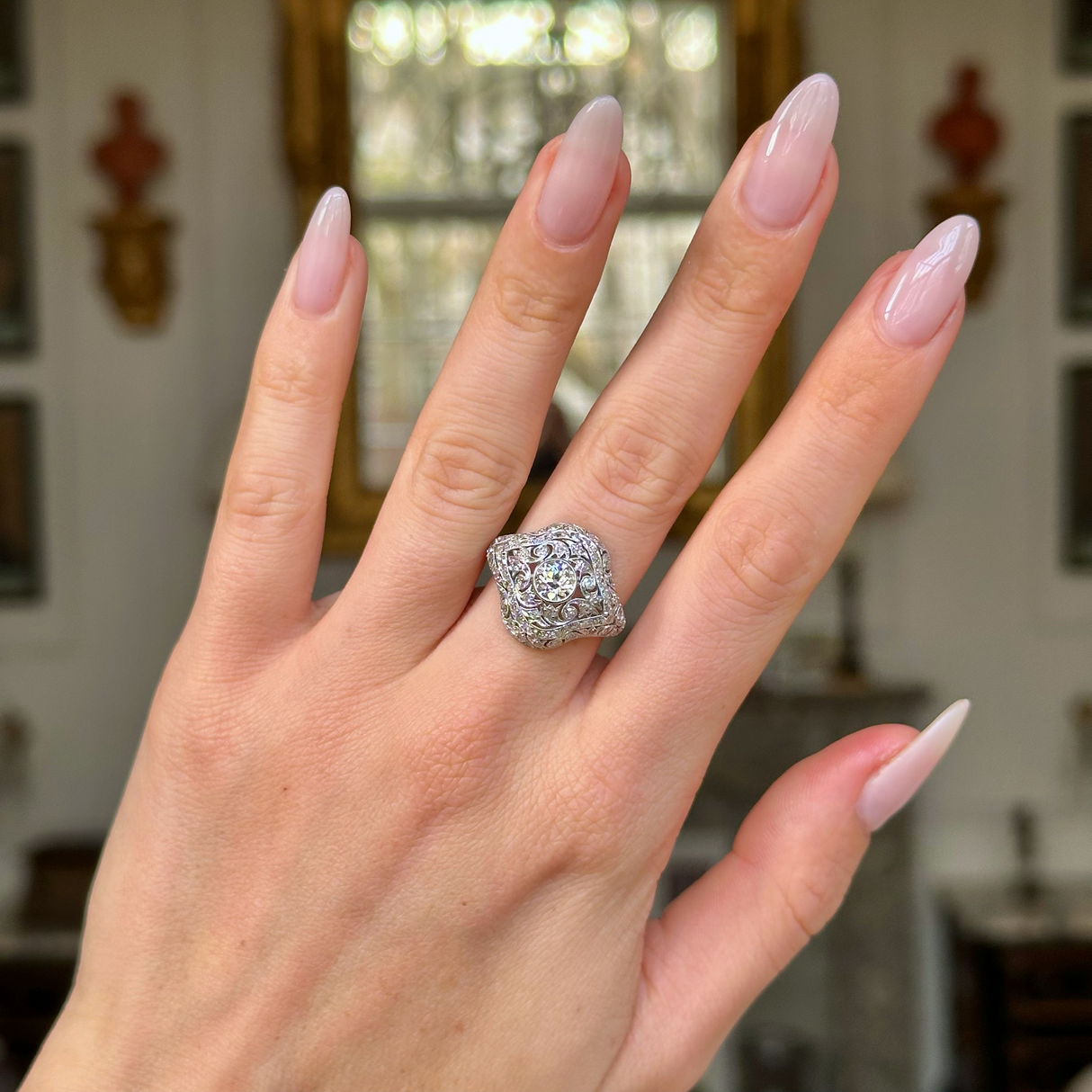 edwardian diamond bombe ring worn on hand. 