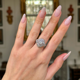 edwardian diamond bombe ring worn on hand. 