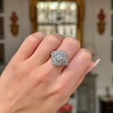 edwardian diamond bombe ring worn on closed hand. 