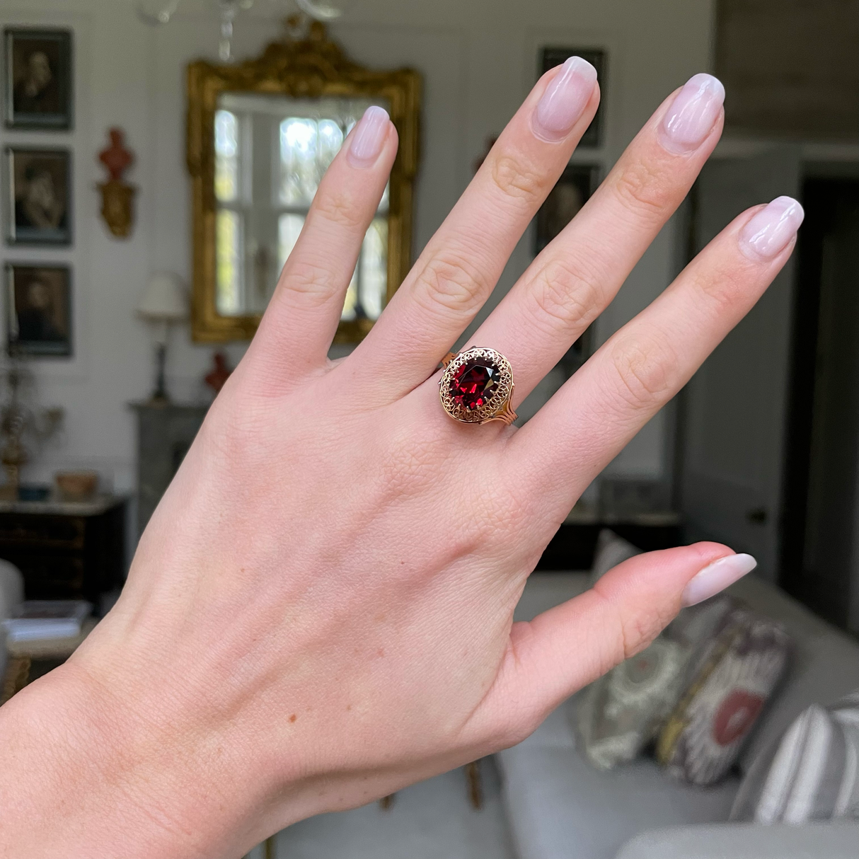 Belle Époque red garnet ring, worn on hand.