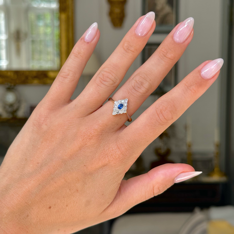 antique edwardian sapphire and diamond kite shaped ring, worn on hand, front view