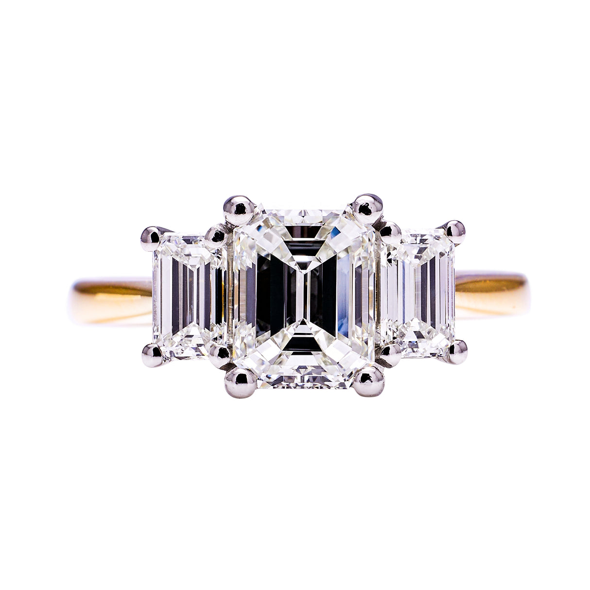 Three stone emerald-cut diamond ring, front view