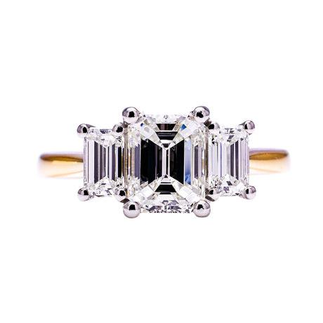 Three stone emerald-cut diamond ring, front view