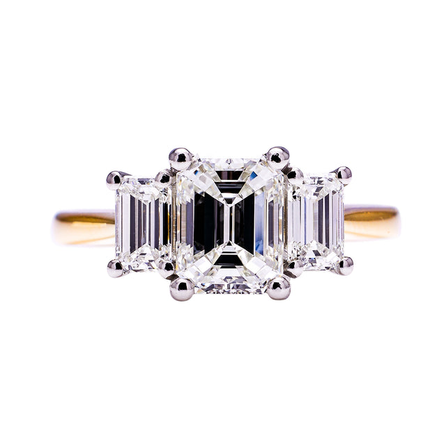 Three stone emerald-cut diamond ring, front view