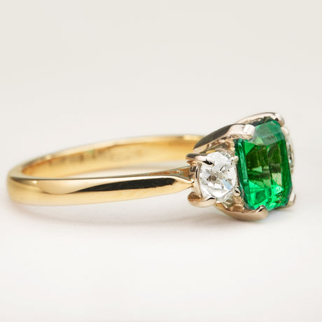 Vintage, emerald and diamond three-stone engagement ring