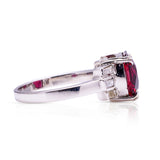 Vintage red garnet and diamond ring, side view.
