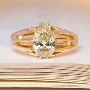 An antique, Edwardian yellow pear-cut diamond solitaire gypsy ring in yellow gold.