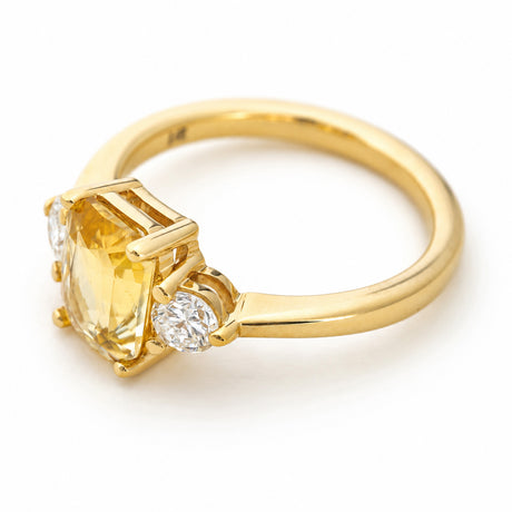 Antique-inspired, yellow sapphire and diamond three-stone engagement ring